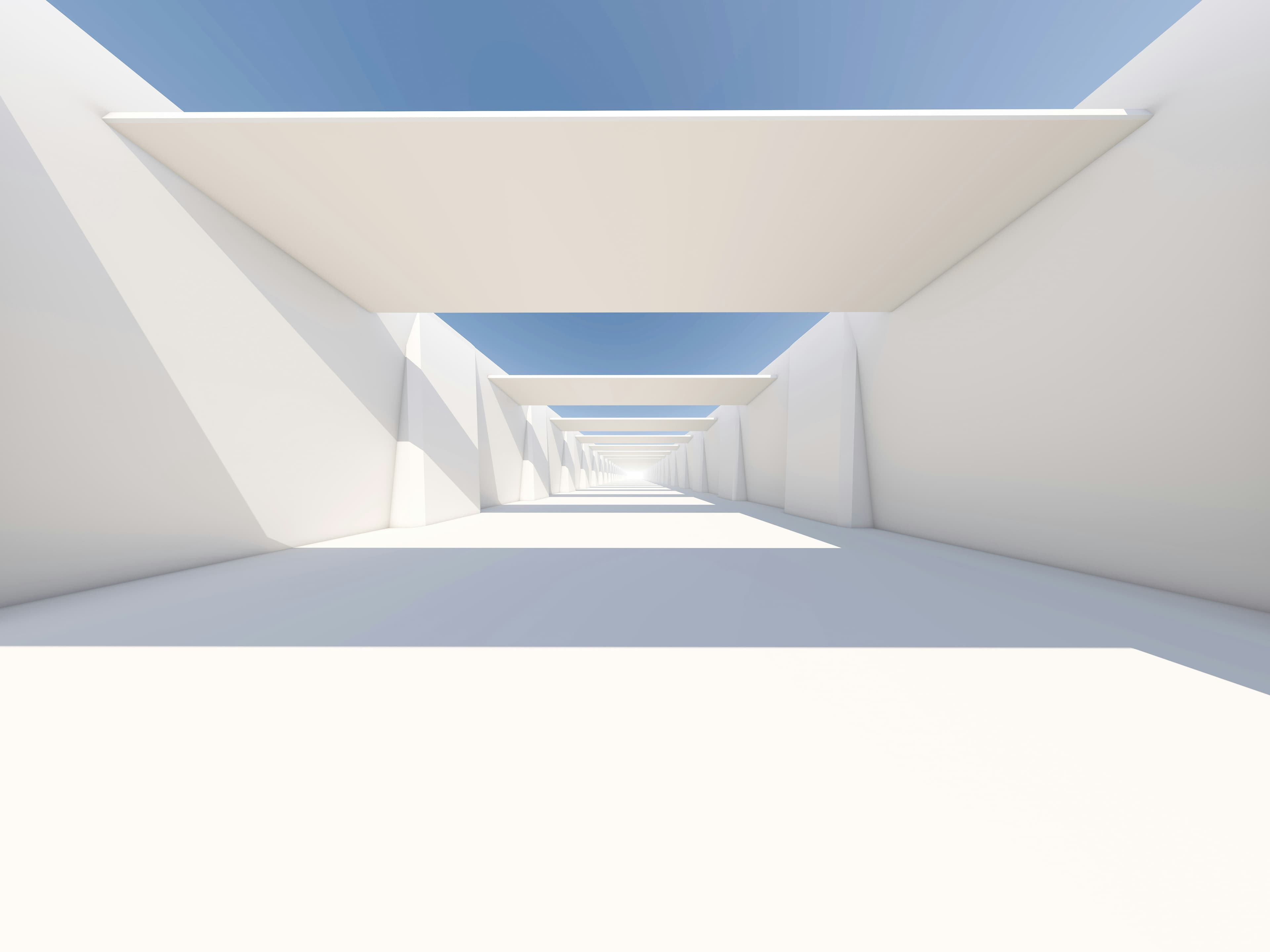 A luminous architectural passage receding toward a distant vanishing point